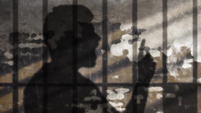 Man Shadow Talking Under Jail Bars. Freedom of Speech Metaphor. Comic Cloud on Concrete Wall.